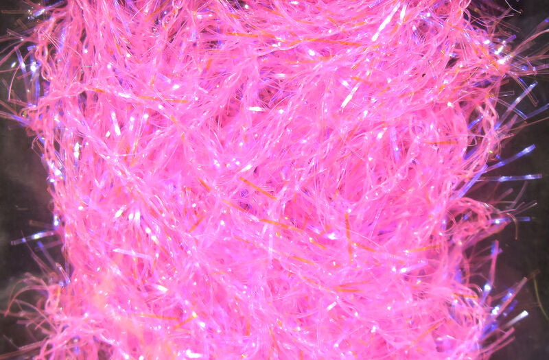 Close-up image of bright pink, fine, fibrous material with iridescent strands used in fishing tackle, specifically Hareline Polar Chenille - Micro for detailed fly tying.