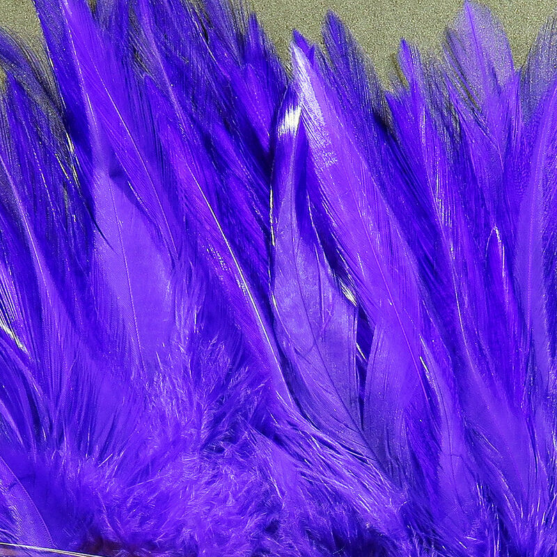 Hareline Strung Saddle Hackle in vibrant purple, featuring long, soft feathers ideal for crafting custom fishing lures and fly fishing tackle.