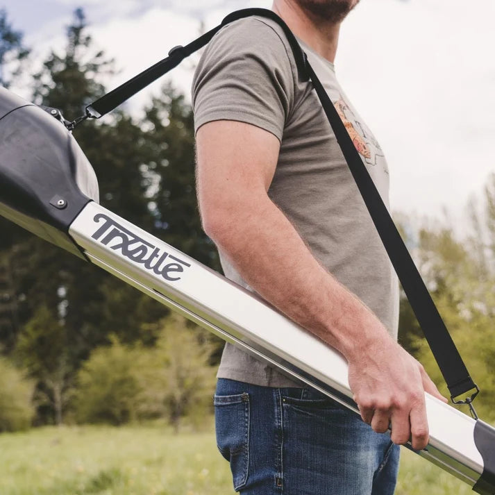 Trxstle CRC Flr Rod Carrier V3.0 carried over an angler’s shoulder outdoors for convenient transport of fishing rods and reels