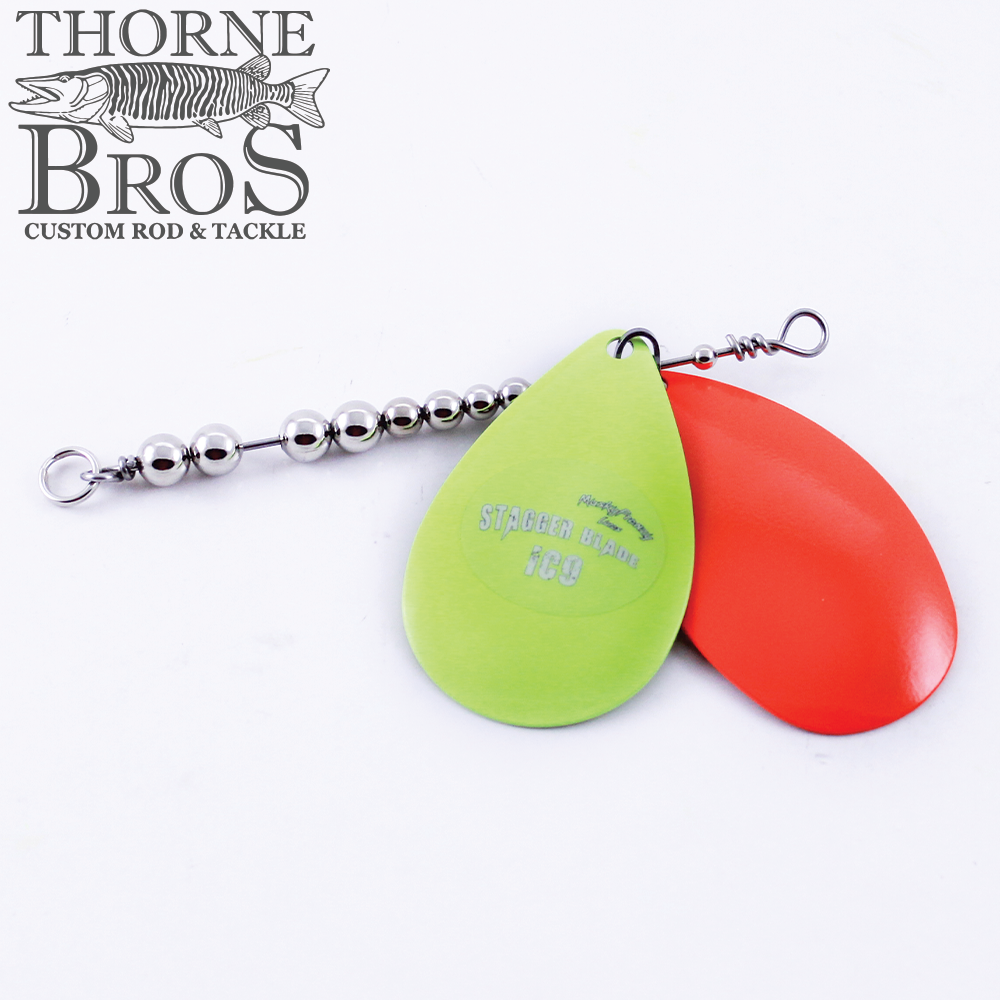 Musky Frenzy Blade Attachments featuring a metal bead chain and two teardrop-shaped blades in bright green and orange, designed for fishing tackle use.